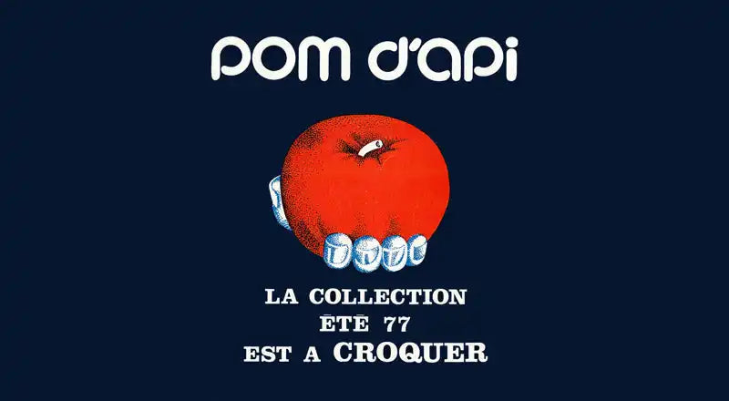 Pomme rouge avec des dents blanches en train de mordre dedans sur un fond bleu foncé.